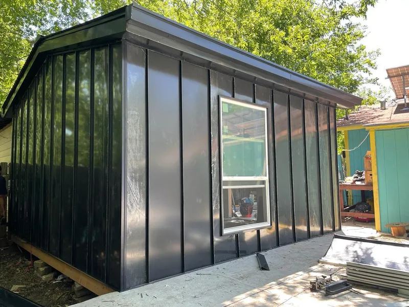 Black standing seam metal wall panels for Roof Inspection in Upper